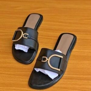 Elegant Women's Black Slides with a large gold D-shaped buckle.