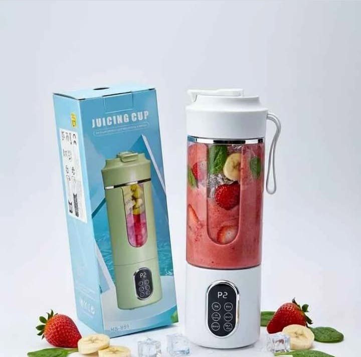Portable Multi-purpose Blender (Juicing Cup) filled with fruit and ice, next to its retail box.