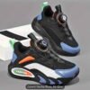 Kids Rotary Buckle Sneakers in black and denim blue with orange and green accents.